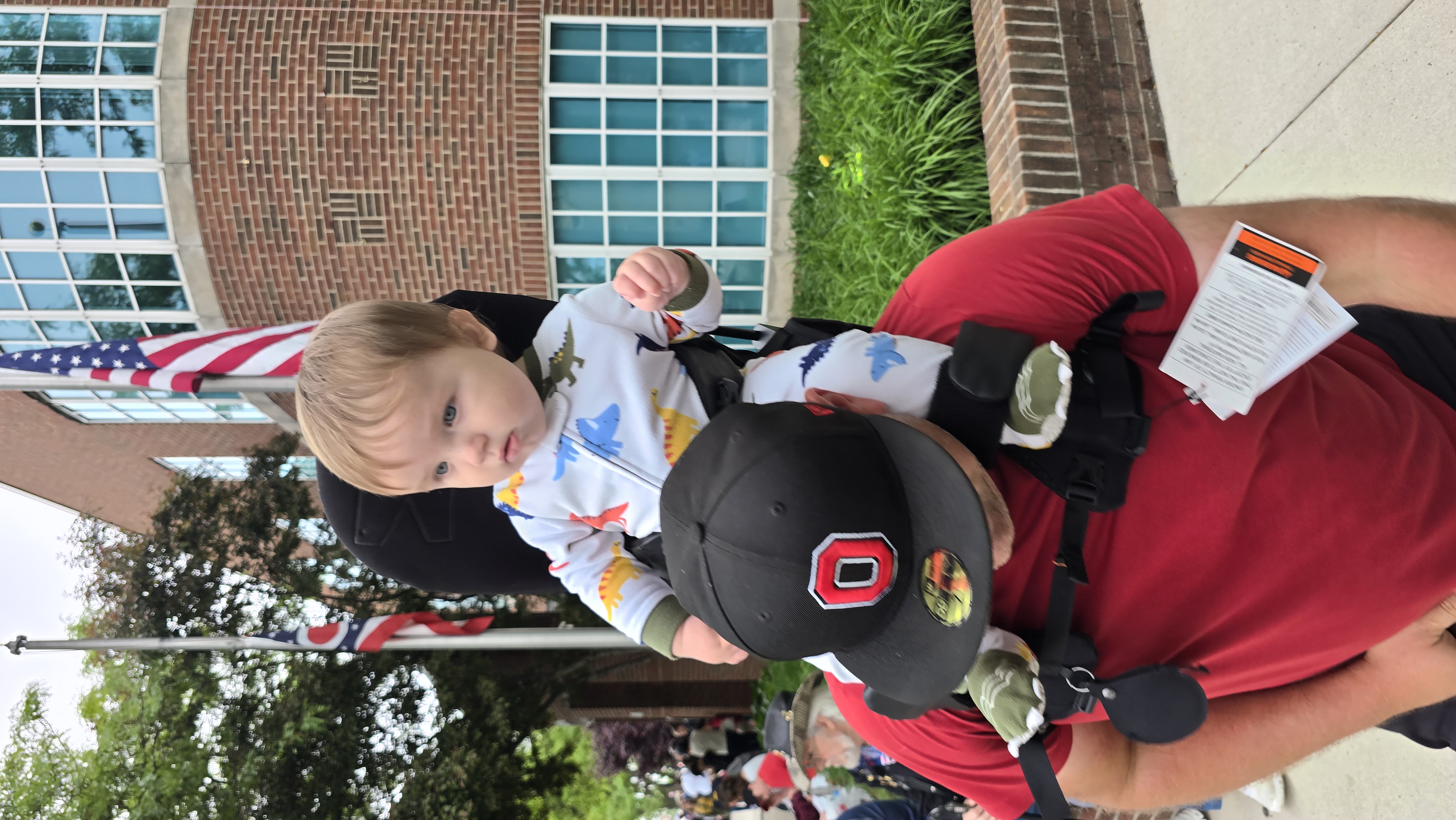 MiniMeis shoulder carrier in use at a parade